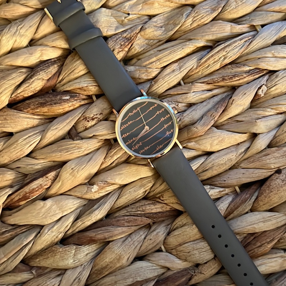 Rose gold watch with cursive letters